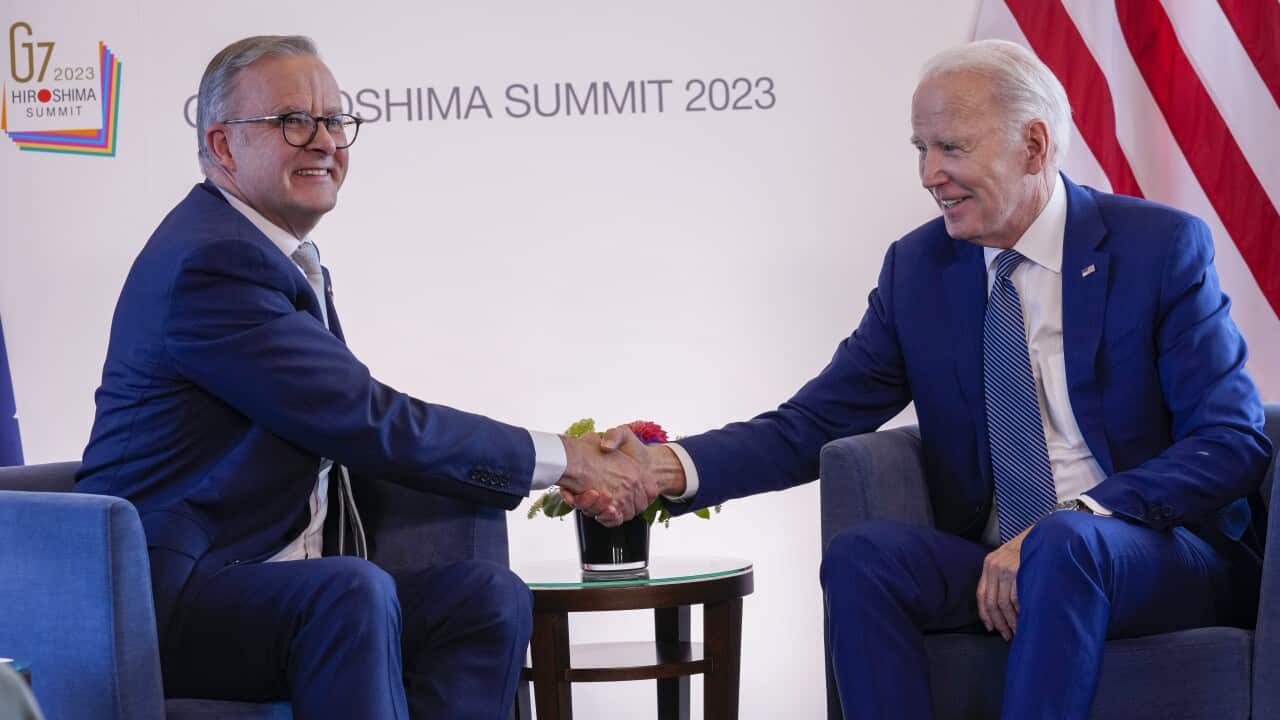 Joe Biden and Anthony Albanese shake hands