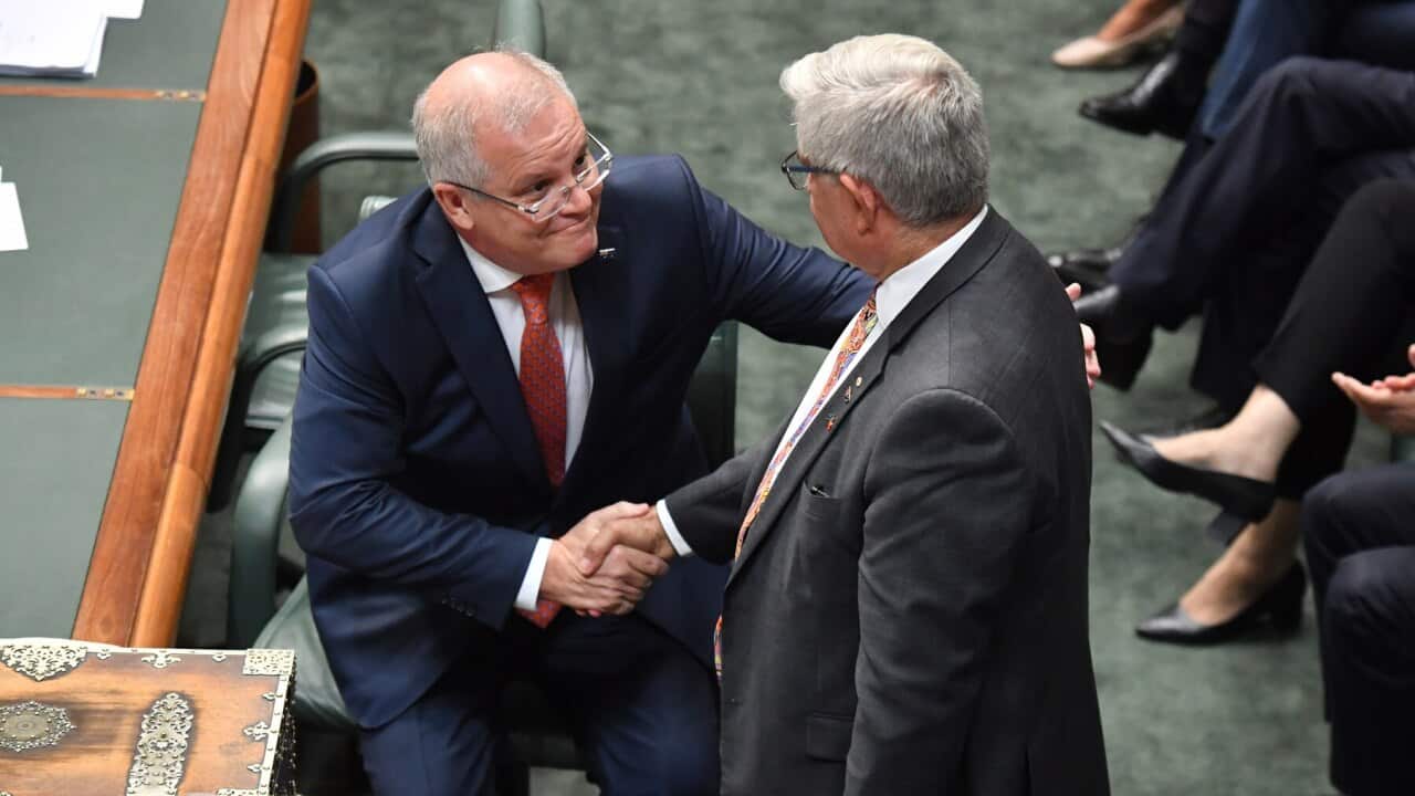 Prime Minister Scott Morrison shakes hands with Minister for Indigenous Australians Ken Wyatt