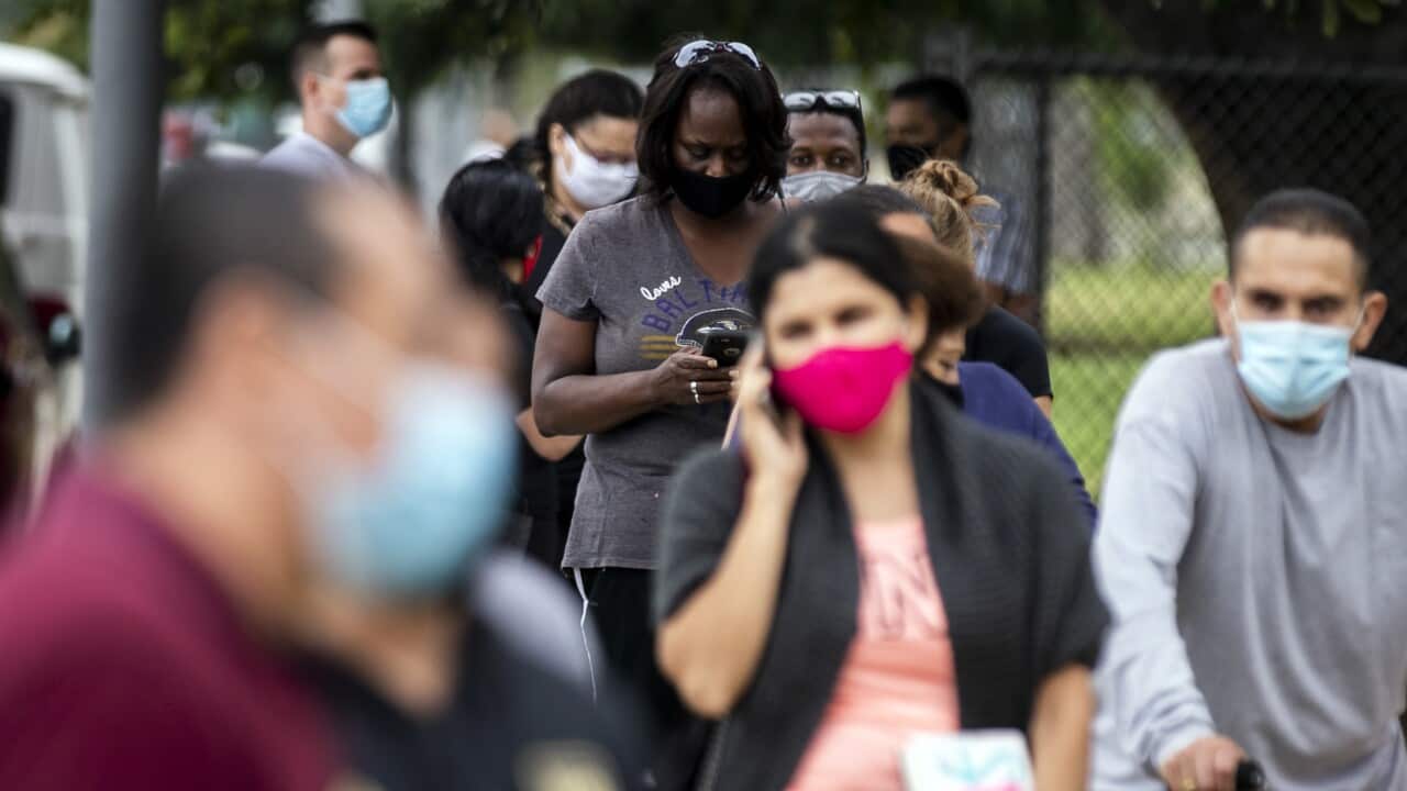 People wait in line to be tested for COVID-19 at a drive-in and walk up testing site in Los Angeles, California, 1 July 2020.