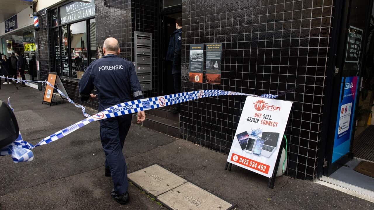 Police walking inside a crime scene