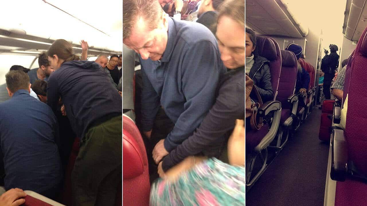 Passengers on board Malaysian Airlines MH128 hold down a man threatening to "blow up the plane".