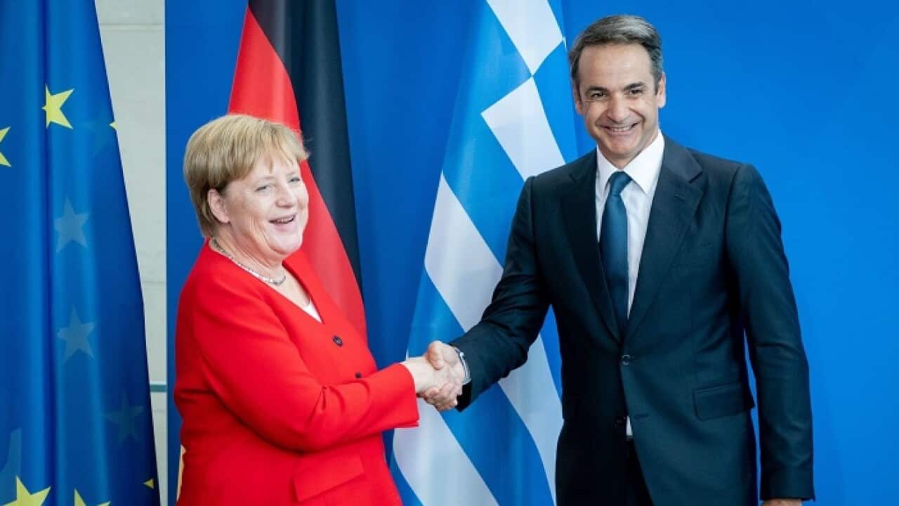 29 August 2019, Berlin: Greek Prime Minister Kyriakos Mitsotakis (L) shakes hands with German Chancellor Angela Merkel (L) during a press conference after their meeting at the Federal Chancellery. Photo: Christoph Soeder/dpa