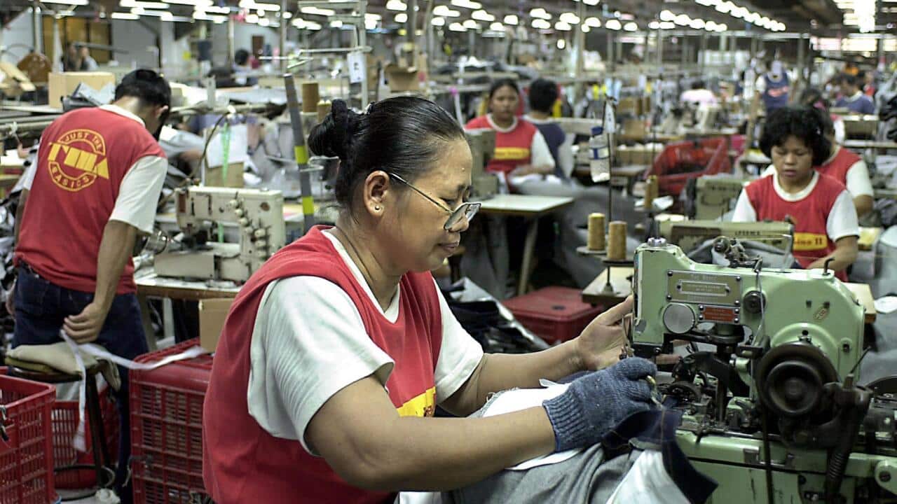 Indonesian women work at a clothing factory in Jakarta 06 January 2004 (File: AFP)