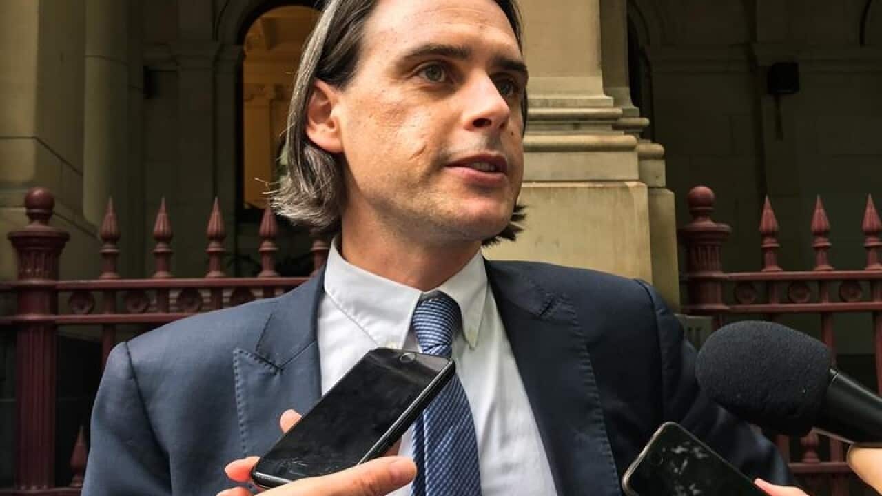 Legal Aid lawyer Hamish McLachlan speaks to the media