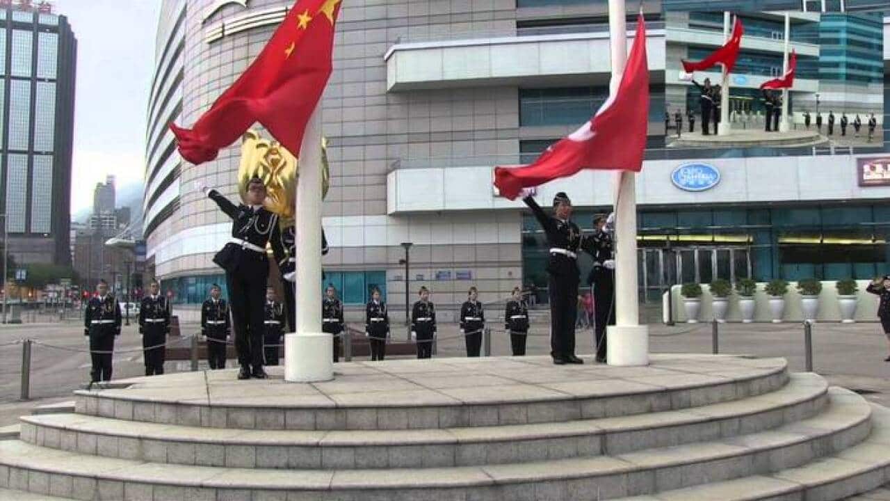 Flag-raising ceremony at Golden Bauhinia Square, and the Convention and Exhibition Centre.