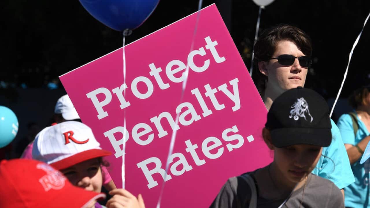 Members of Queensland Unions are seen during a Labour Day Parade in Brisbane, Monday, May 1, 2017. (AAP Image/Dave Hunt) NO ARCHIVING