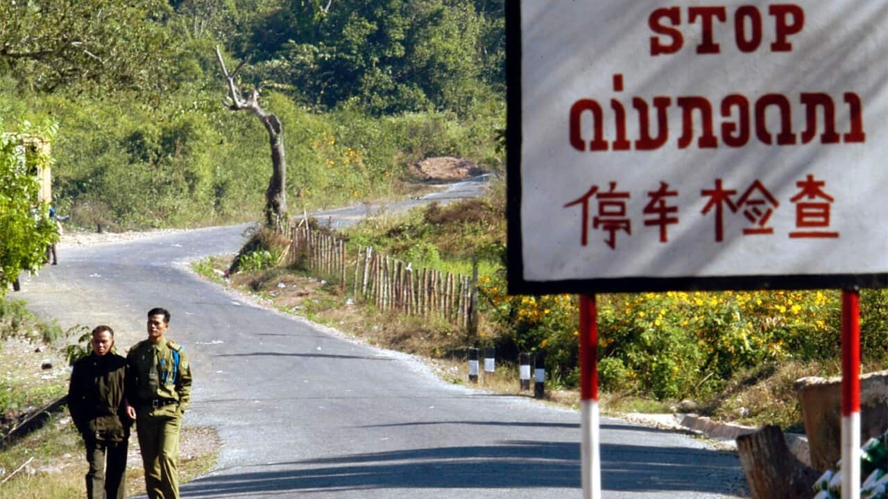 Laotian border guards walk the no man land between Laos and China (AAP Image-AP Photo-David Longstreath)
