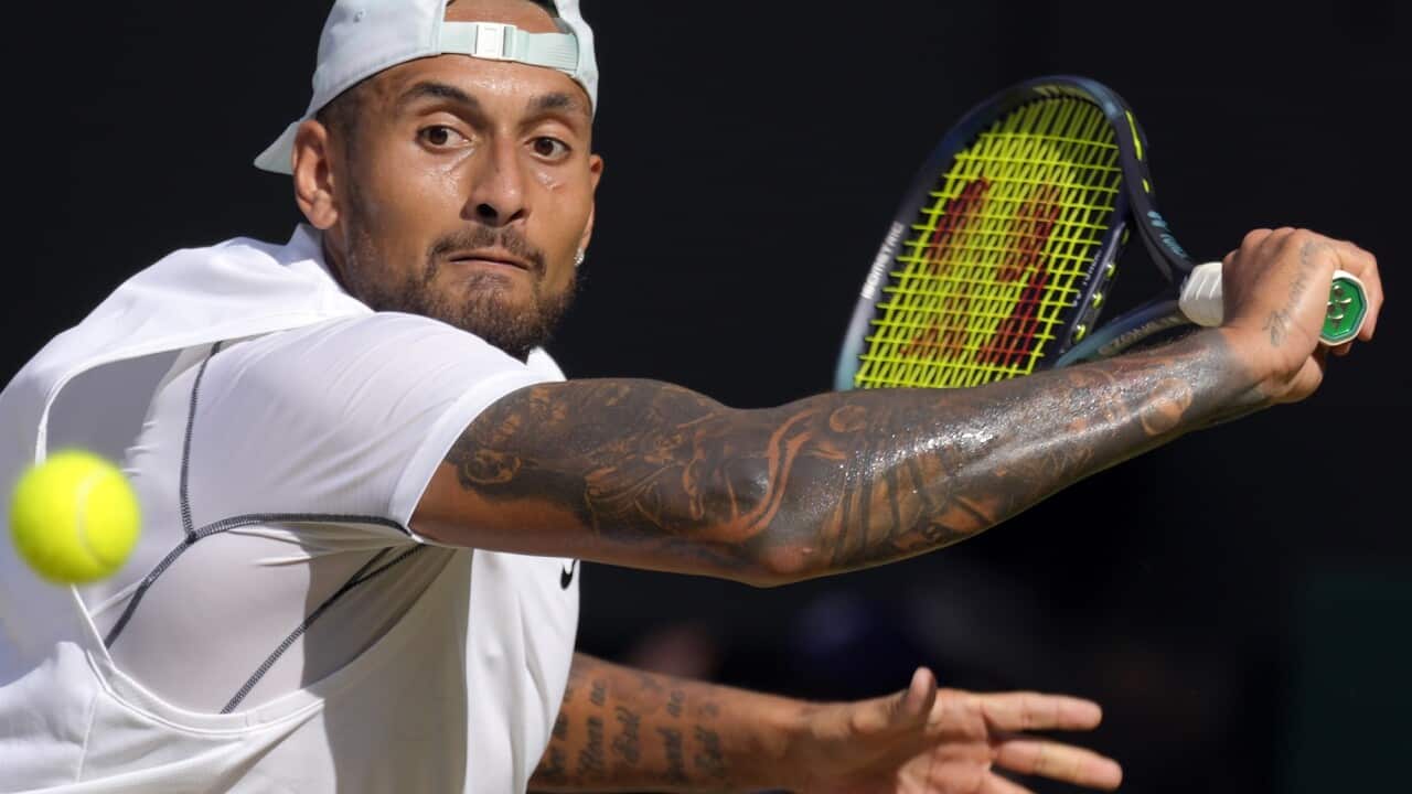 Australia's Nick Kyrgios returns to Serbia's Novak Djokovic during the final of the men's singles on day fourteen of the Wimbledon tennis championships in London on 10 July 2022.