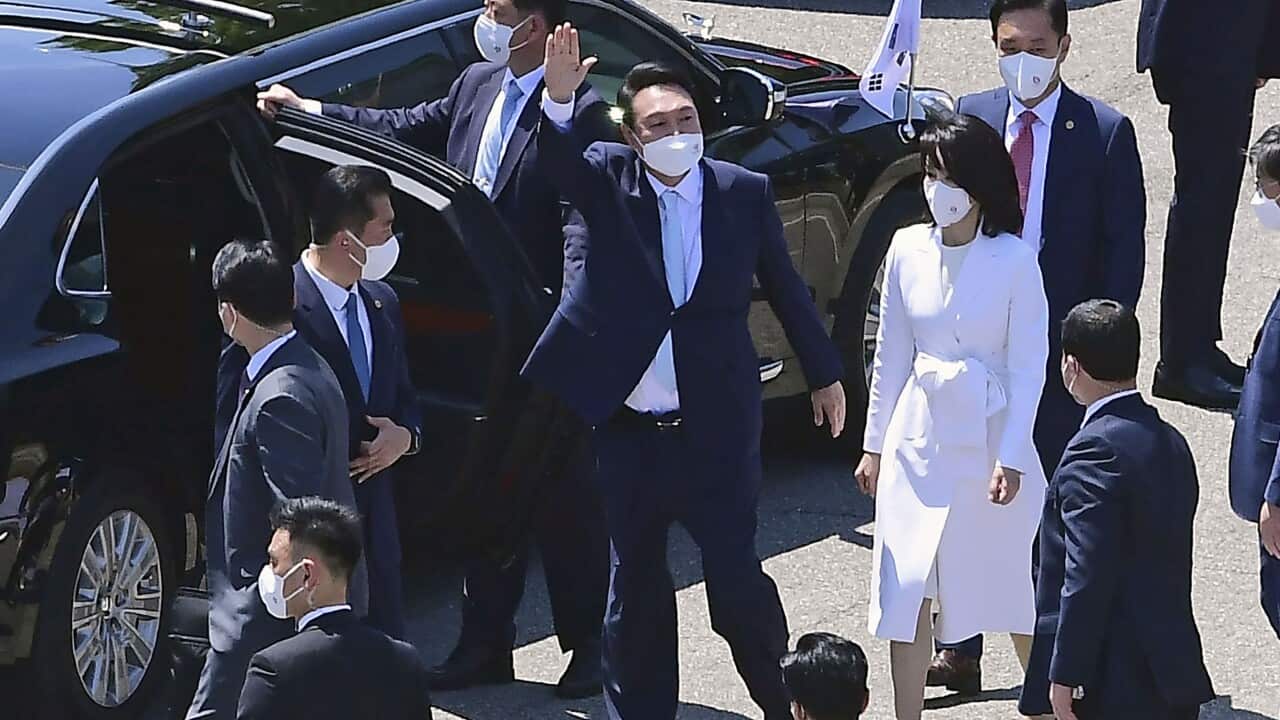 South Korean President Yoon Suk Yeol (C) waves after attending the inauguration ceremony for him in the National Assembly compound in Seoul on May 10, 2022. (Kyodo via AP Images) ==Kyodo