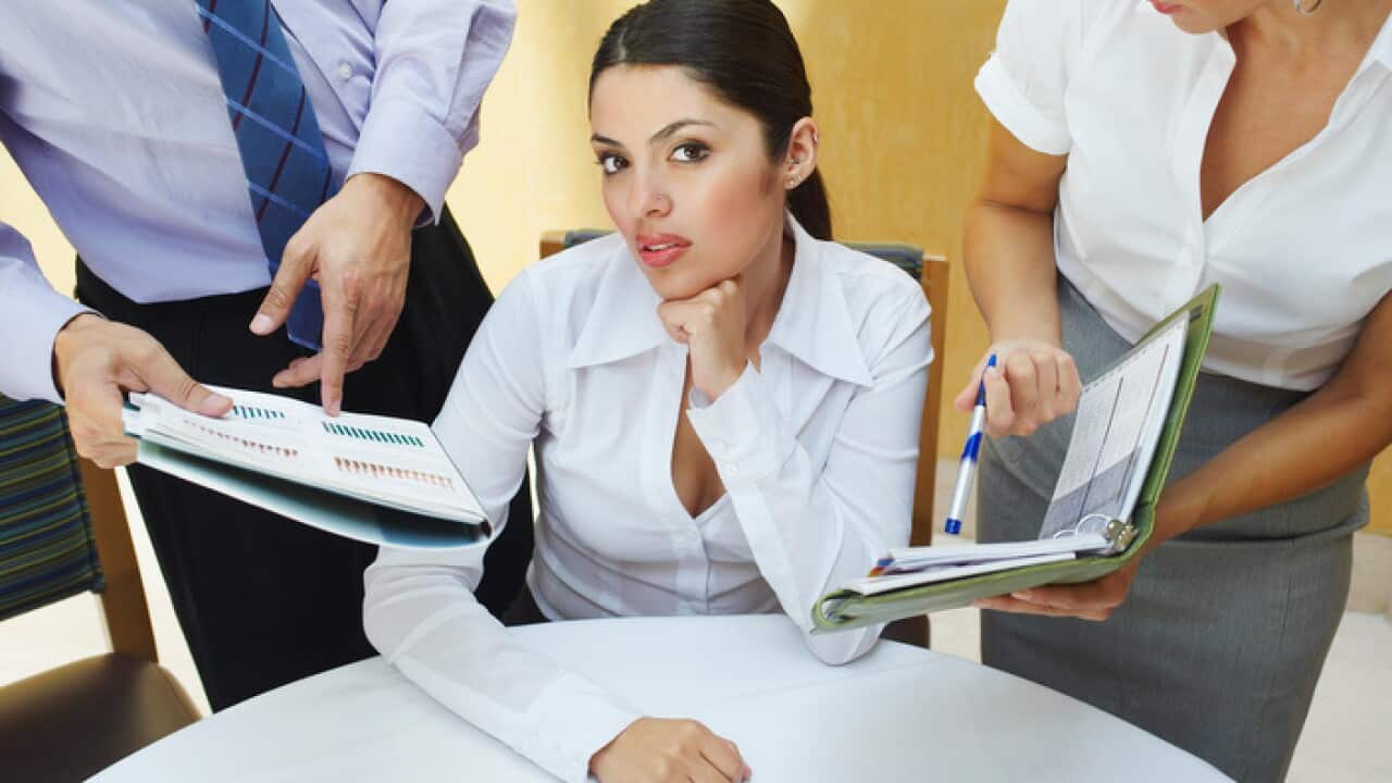 Business woman with too much paperwork