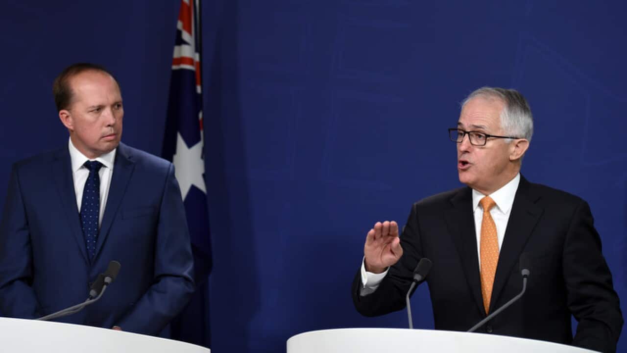 Australian Prime Minister Malcolm Turnbull (right) and Immigration and Border Protection Minister Peter Dutton