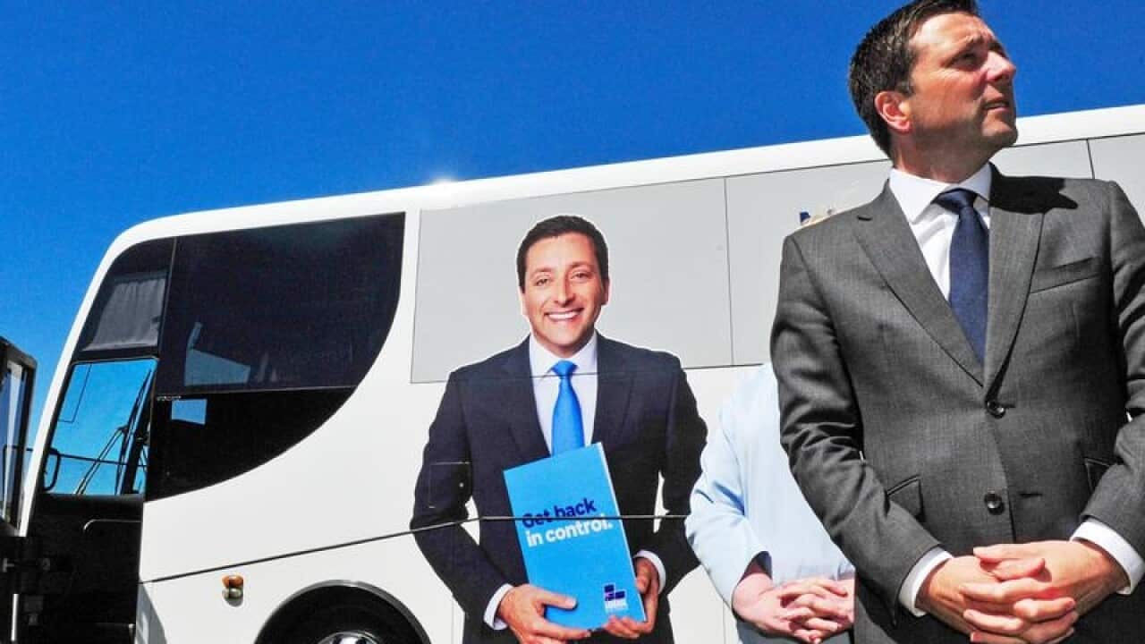 Victorian Opposition Leader Matthew Guy in front of his campaign bus.