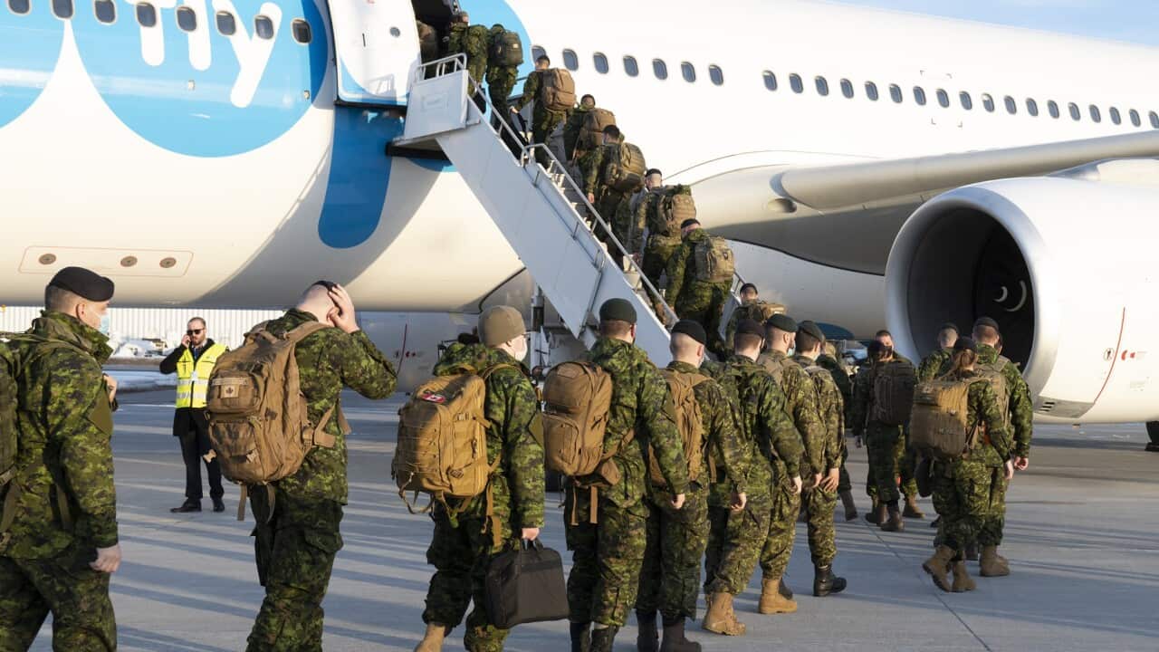 Canadian soldiers board an aircraft for deployment to Latvia, Wednesday, March 23, 2022 in Quebec City, part of Canada's and NATO's decision to strengthen their presence in Central and Eastern Europe.