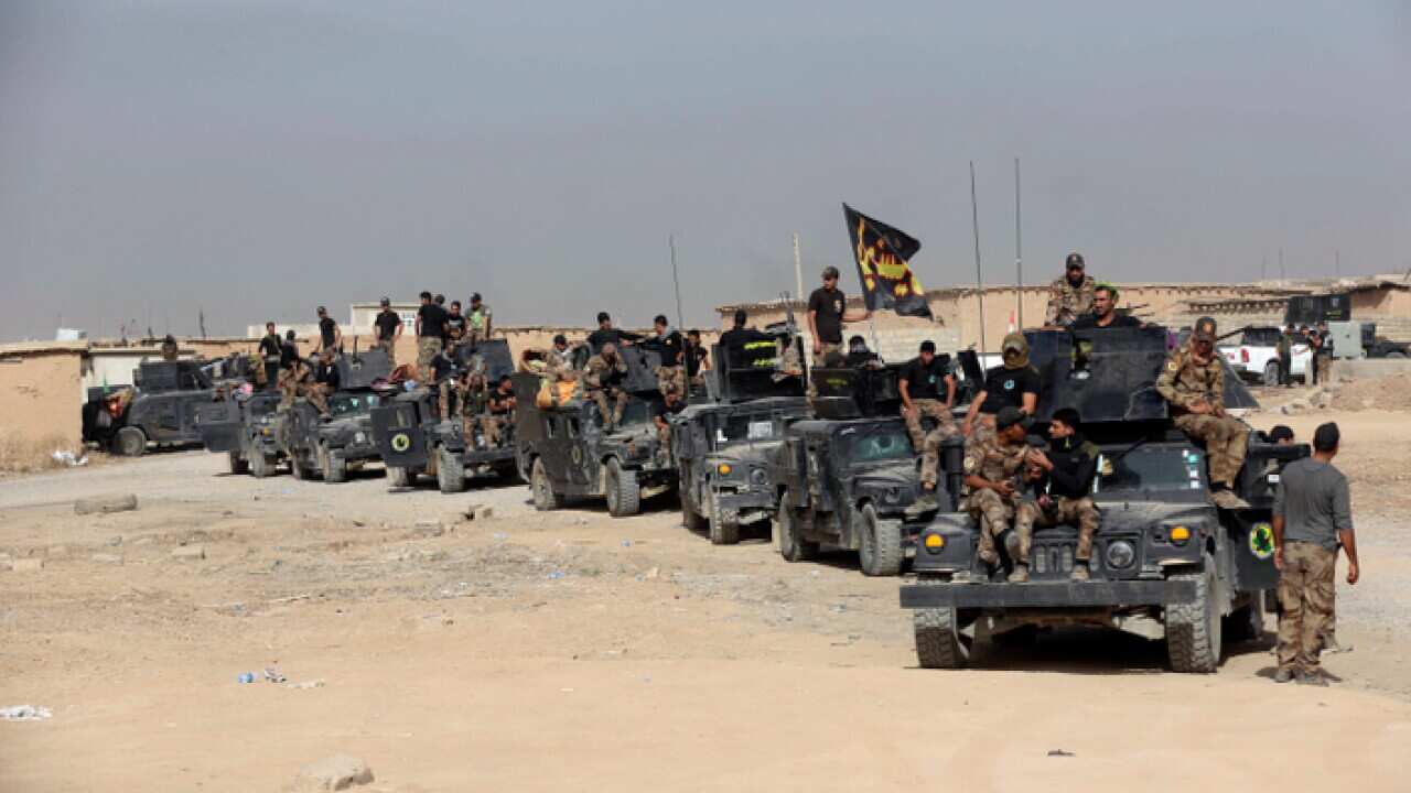 Iraq's elite counterterrorism forces gather ahead of an operation to re-take Mosul
