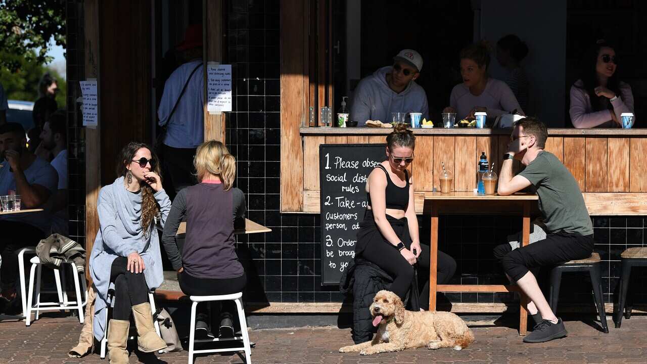 Diners seen at a cafe in Bronte in Sydney, Sunday, 19 July, 2020.