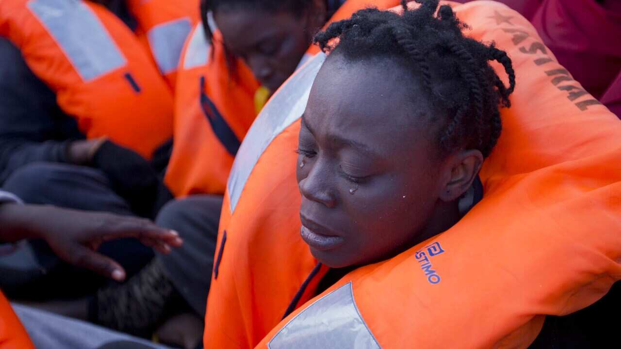 Sabine, from Ivory Coast, cries after being rescued by members of the Spanish NGO Proactiva Open Arms, 21 miles north of Libya on Friday, Feb. 3, 2017.