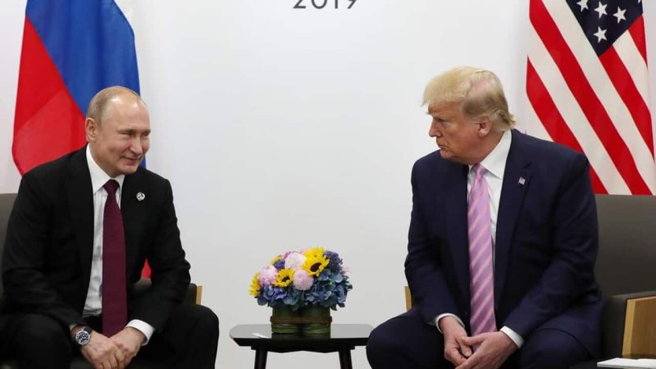 Vladimir Putin (L) and US President Donald J. Trump (R)