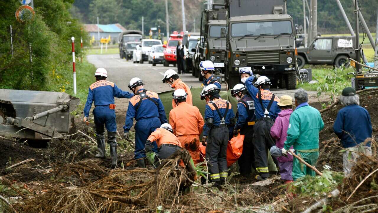 Rescuers find a missing person at the site of a landslide triggered by an earthquake in Atsuma town, Hokkaido, southern Japan.