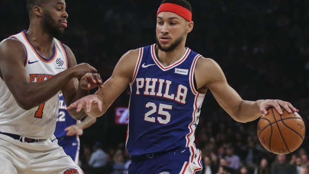 Philadelphia's Ben Simmons drives past New York's Emmanuel Mudiay.