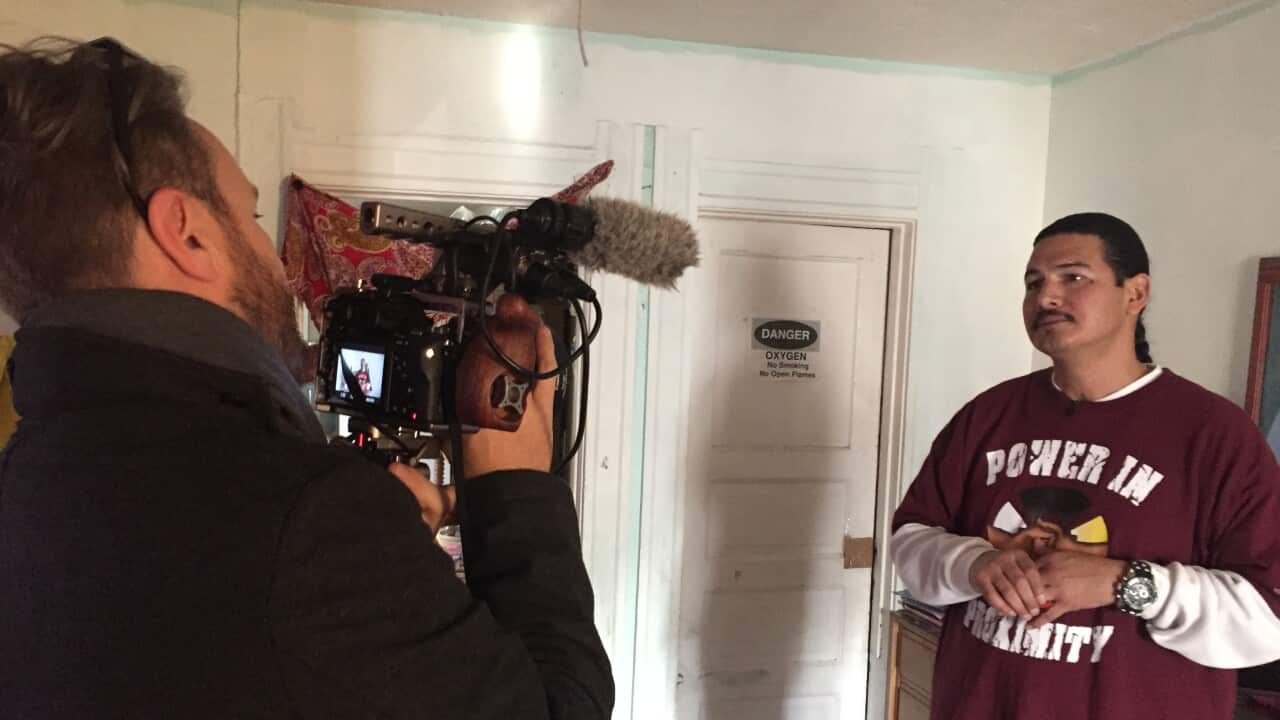 Reporter Dean Cornish interviews Raymond Aguilar.