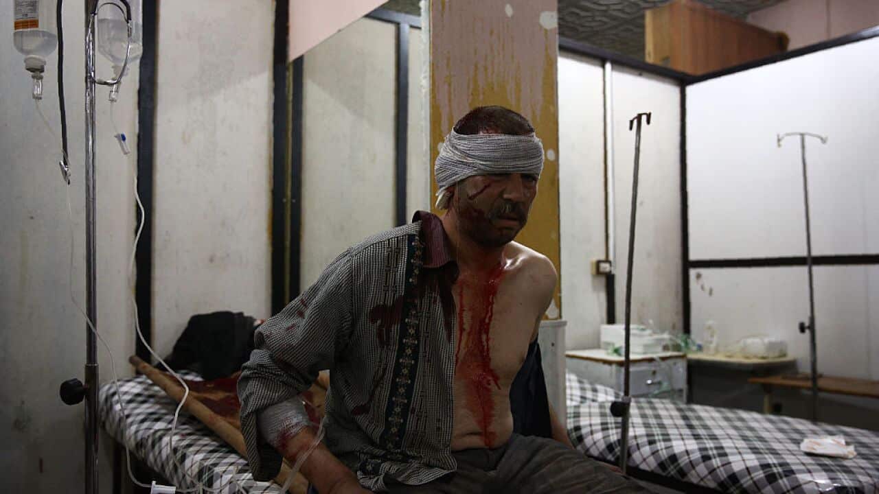 A man receives treatment at a make-shift hospital, following a reported airstrike on the besieged rebel-controlled city of Douma, a flashpoint near the Syrian capital on February 15, 2016.