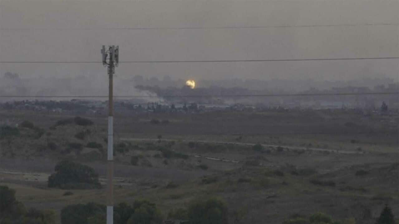 Flames and smoke rising from what Palestinian medics say is an Israeli airstrike in Gaza (AAP)