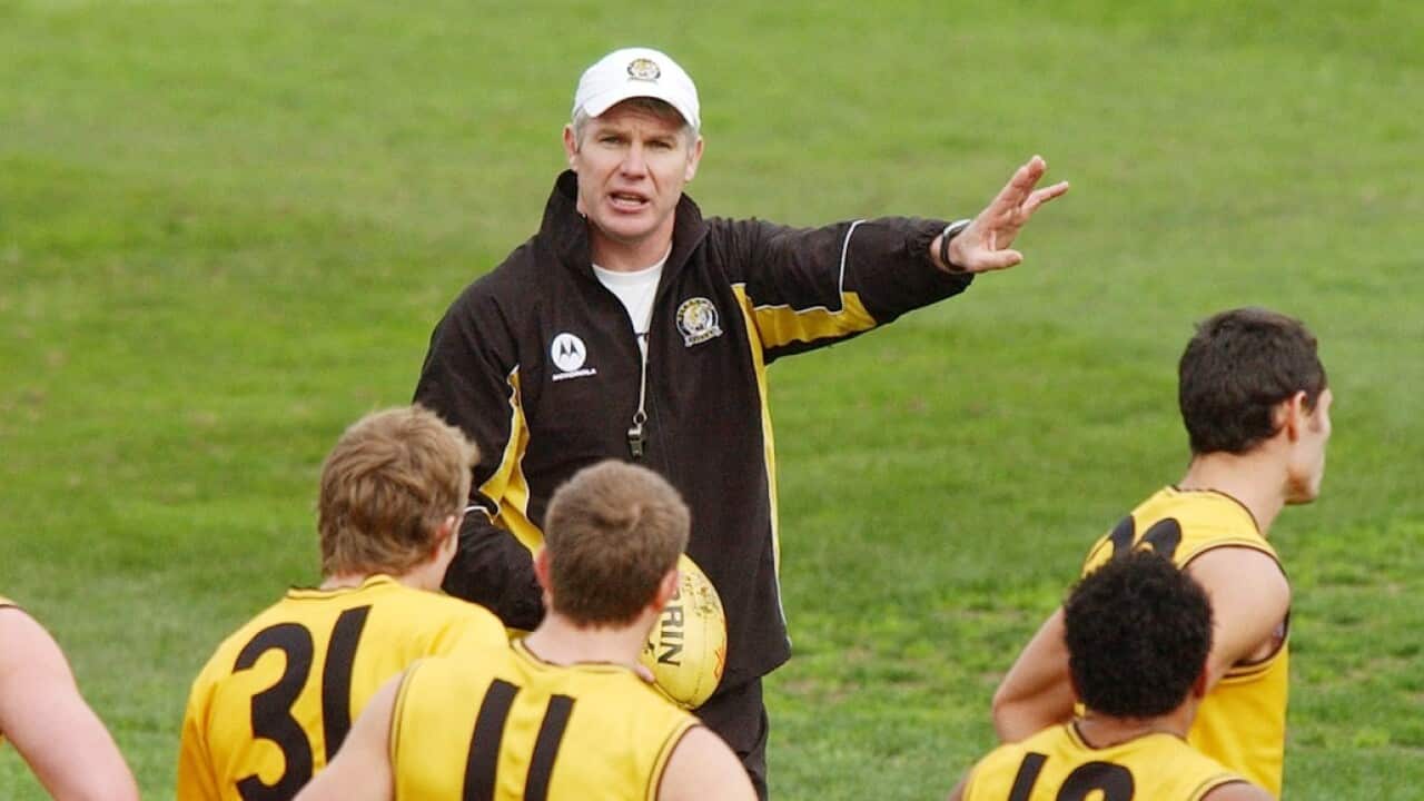 Danny Frawley puts Richmond through a training session.