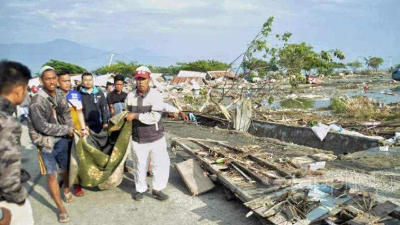 Rescuers search following the Indonesian tsunami.
