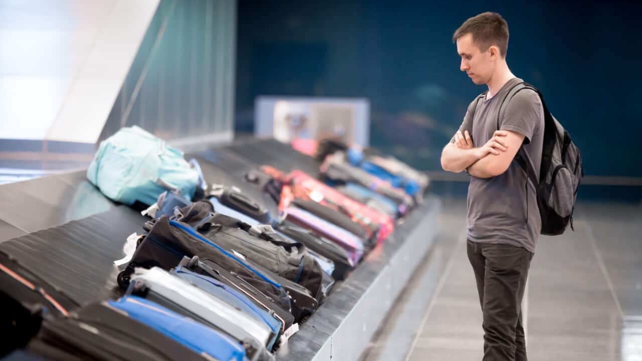 Young man waiting for baggage.