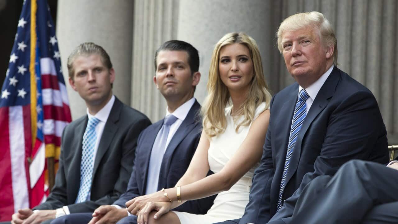 Donald Trump, right, sits with his children, from left, Eric Trump, Donald Trump Jr., and Ivanka Trump