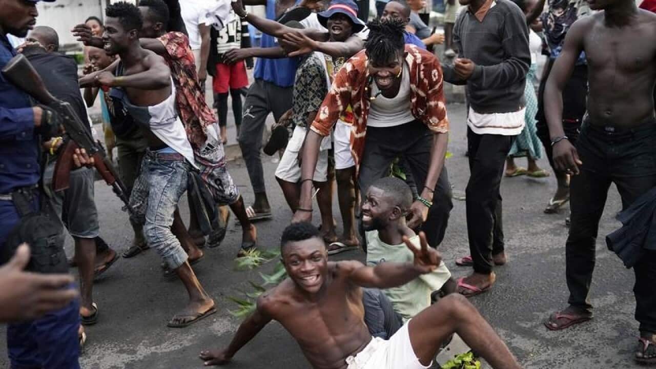 Kinshasa residents celebrate the result of the Congo election