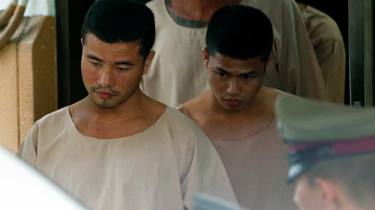 Zaw Lin (L) and Wai Phyo (R) are escorted by Thai police officers after they were sentenced to death in 2014.
