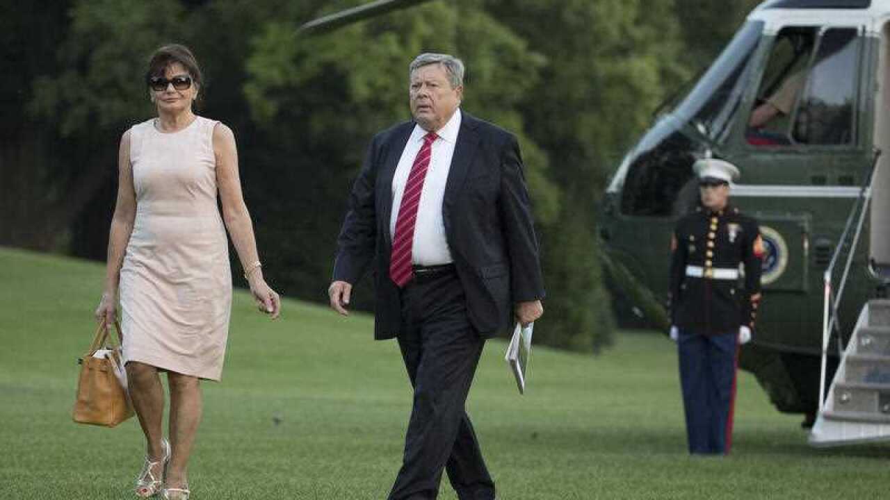 Viktor and Amalija Knavs, the parents of first lady Melania Trump, walk from Marine One across the South Lawn to the White House in Washington, Sunday, June 11