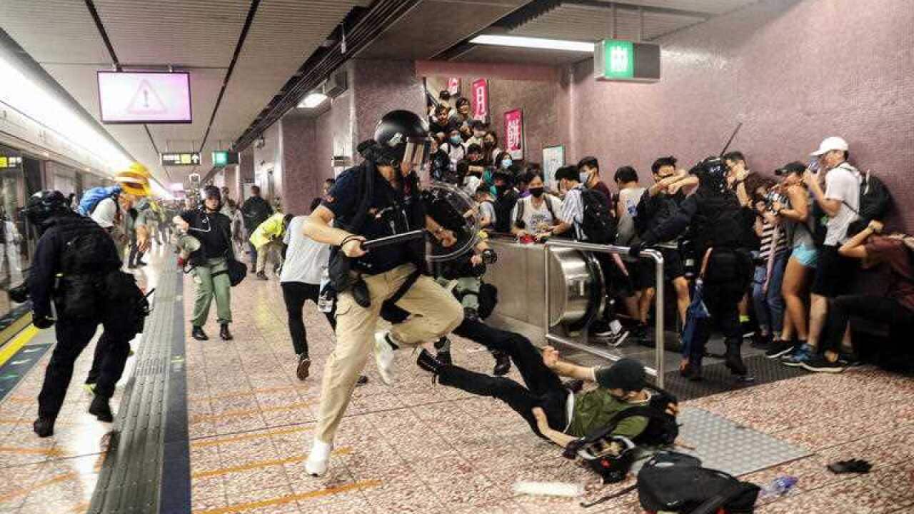 Police attempt to arrest protesters at Prince Edward MTR Station, Hong Kong, Saturday, Aug. 31, 2019.