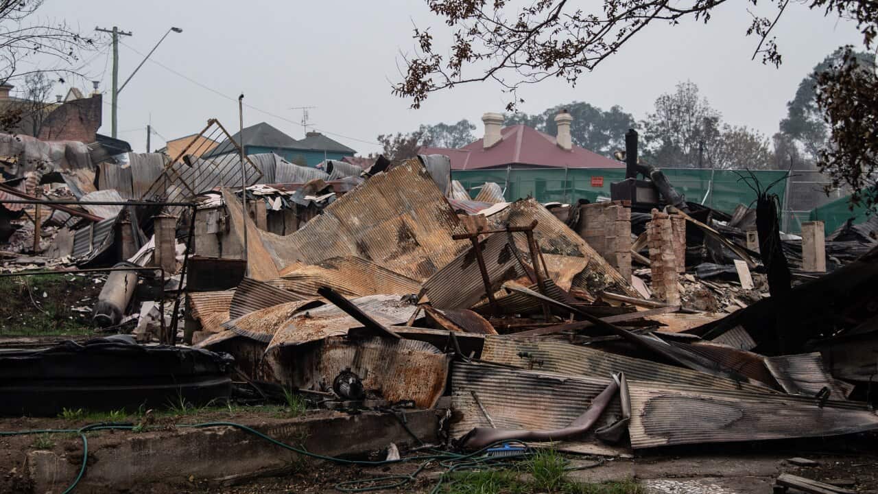 The remains of burnt-out businesses, in close proximity to unaffected buildings in Cobargo, NSW.