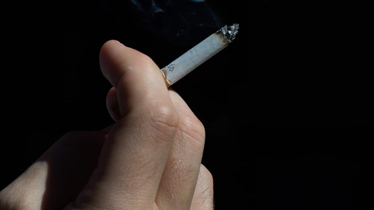 A smoker enjoys a cigarette