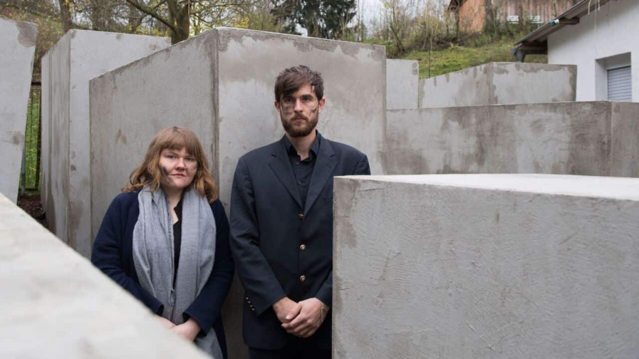Members of the Centre of Political Beauty inside the replica of Berlin's Holocaust Memorial