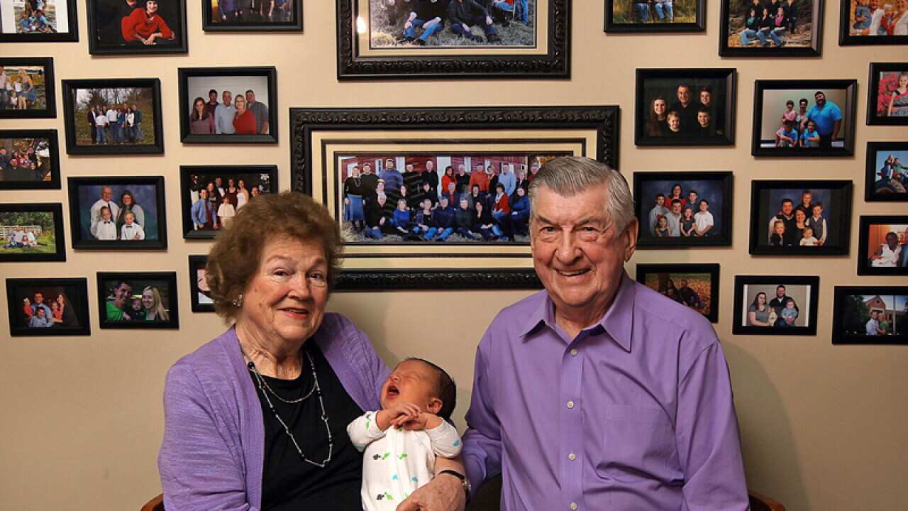 Leo and Ruth Zanger sit with their 100th grandchild