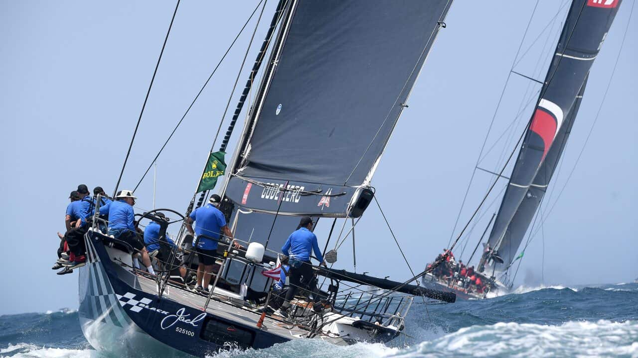 Black Jack and Scallywag (right) leave the heads at the start of the Sydney to Hobart Yacht race in Sydney, Thursday, December 26, 2019. (AAP Image/Dan Himbrechts) NO ARCHIVING, EDITORIAL USE ONLY