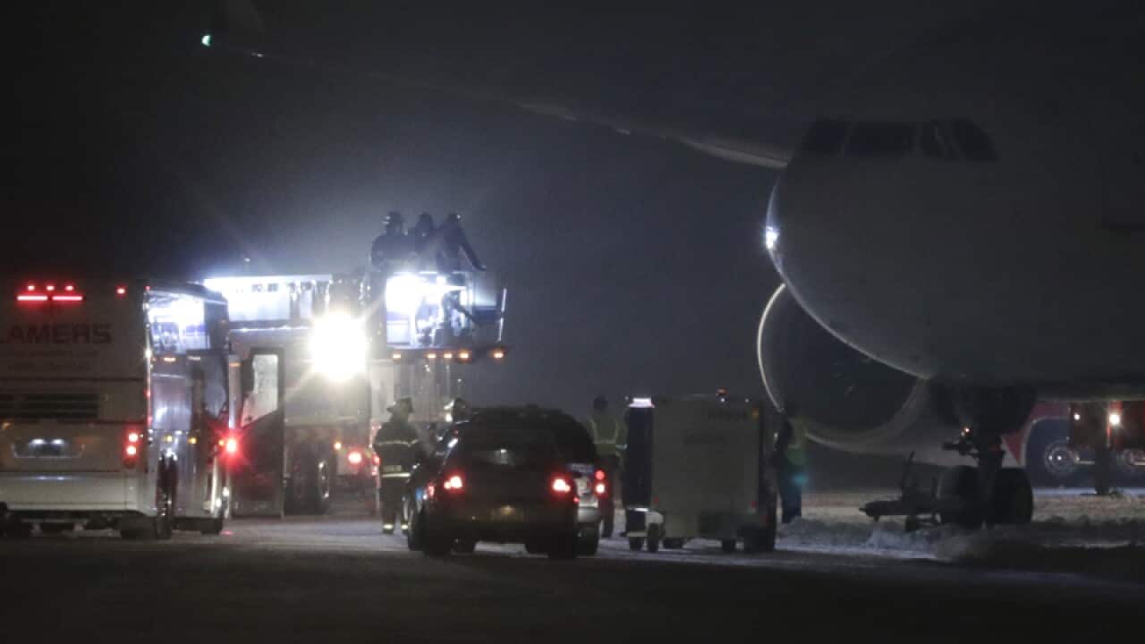 Minnesota Vikings players and staff are taken off a plane