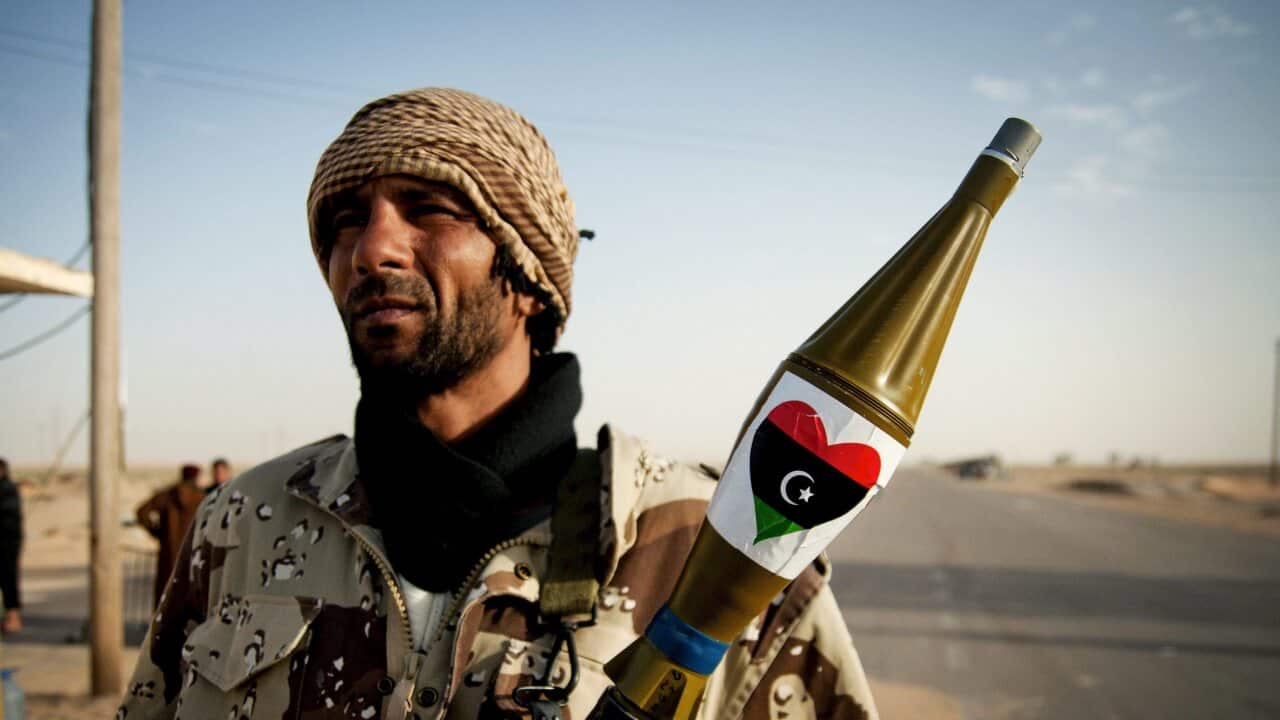 A Libyan rebel soldier holds a RPG launcher at a road check point, near the city of Ajdabiya, Eastern Lybia.
