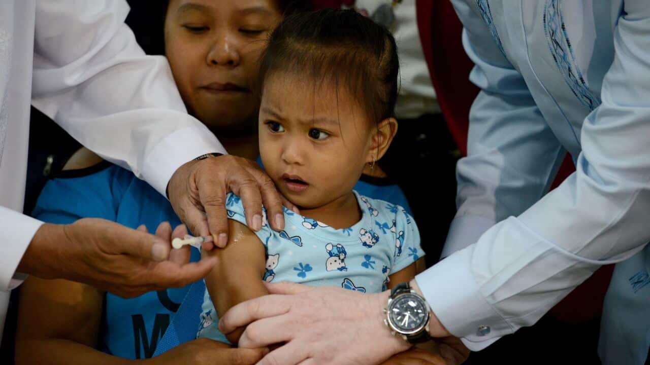 A child in the Philippines is vaccinated against measles aap.jpg