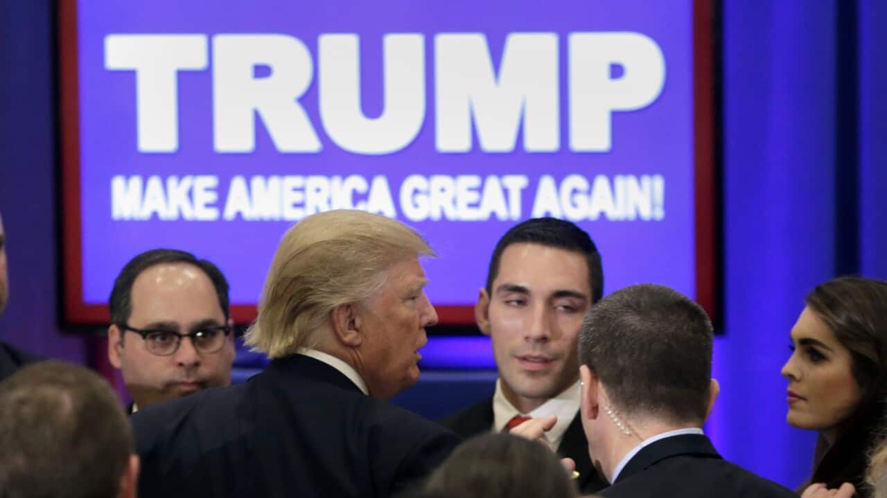 Republican presidential candidate Donald Trump, center