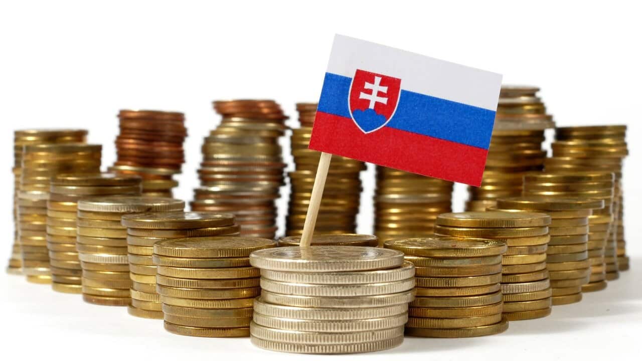 Slovakia flag waving with stack of money coins