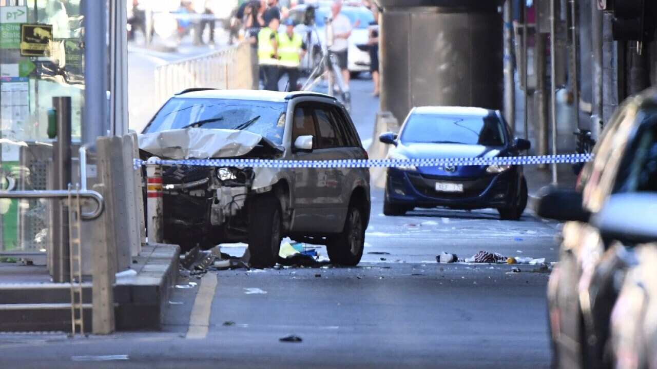 A damaged vehicle is seen at the scene of an incident on Flinders Street, in Melbourne, Thursday, December 21, 2017.