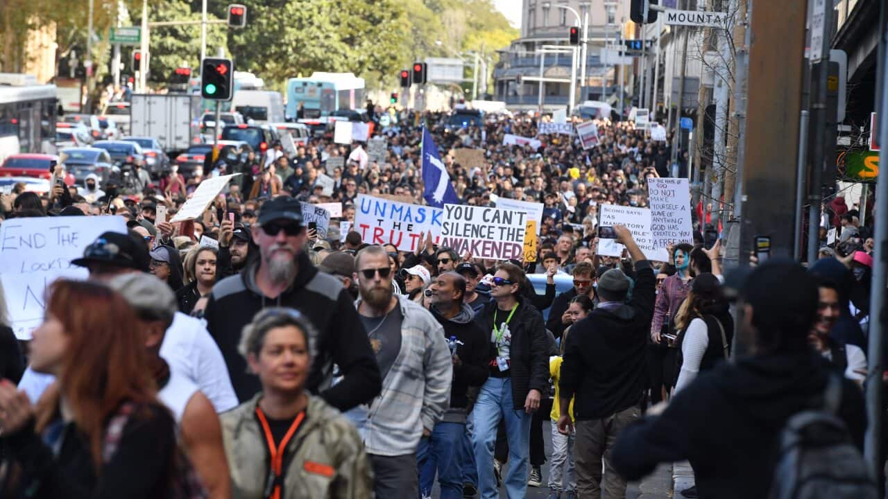 Protesters march along Broadway and George St towards Sydney Town Hall during the World Wide Rally For Freedom anti-lockdown rally.