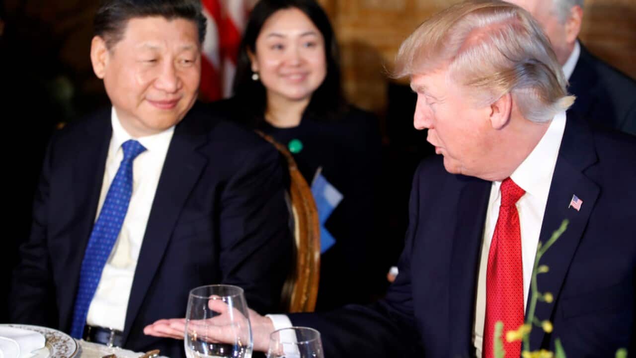 President Donald Trump, right, extends his hand to shakes hands with Chinese President Xi Jinping during a dinner at Mar-a-Lago, Thursday, April 6, 2017, in Palm Beach, Fla. (AP Photo/Alex Brandon)