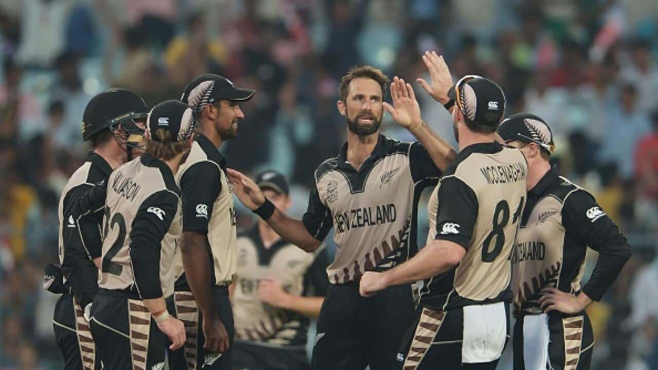 New Zealand's Grant Elliott(C)celebrates with teammates after the dismissal of Bangladesh's captain Mashrafe Bin Mortaza