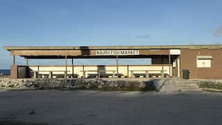 A concrete building that says Nauru fish market