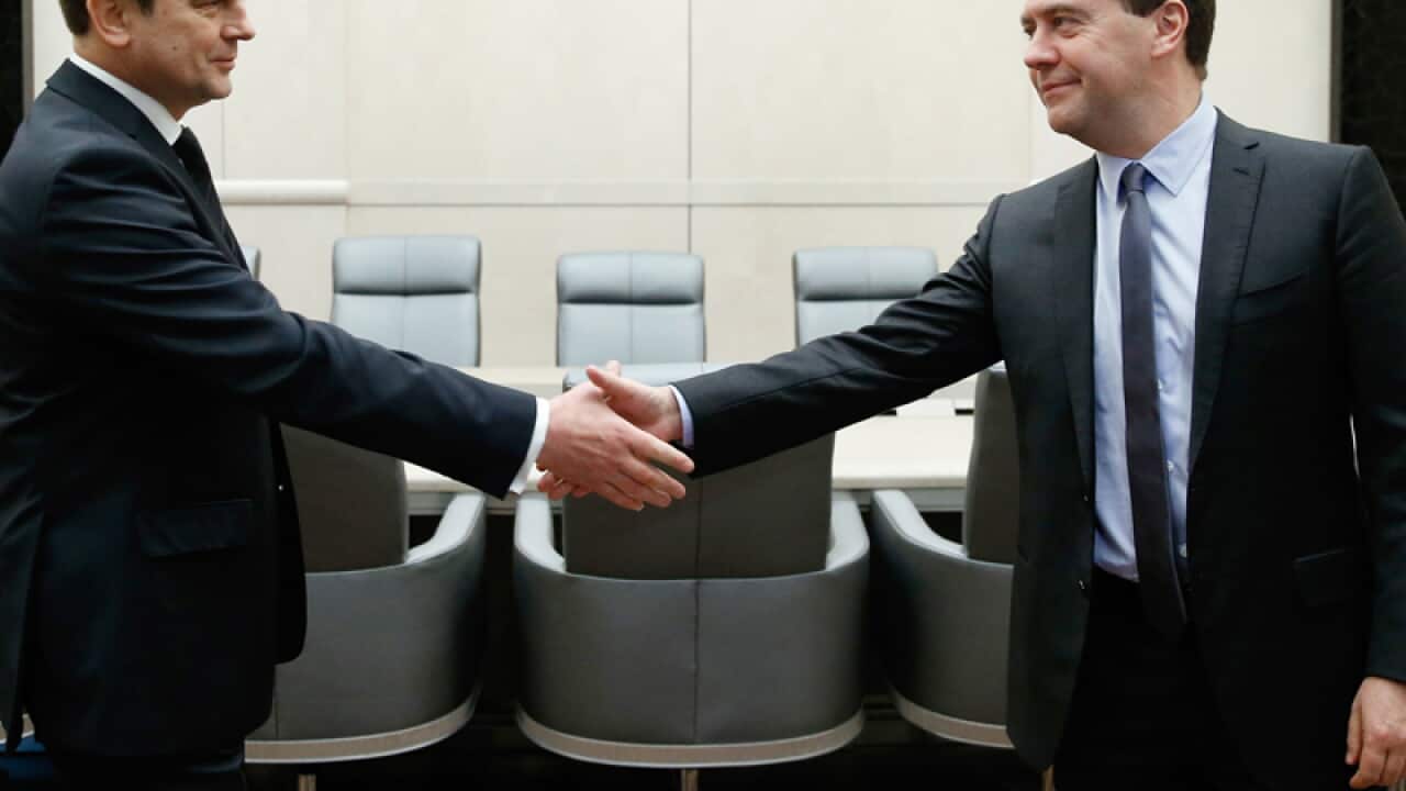 Russian Prime Minister Dmitry Medvedev (R)